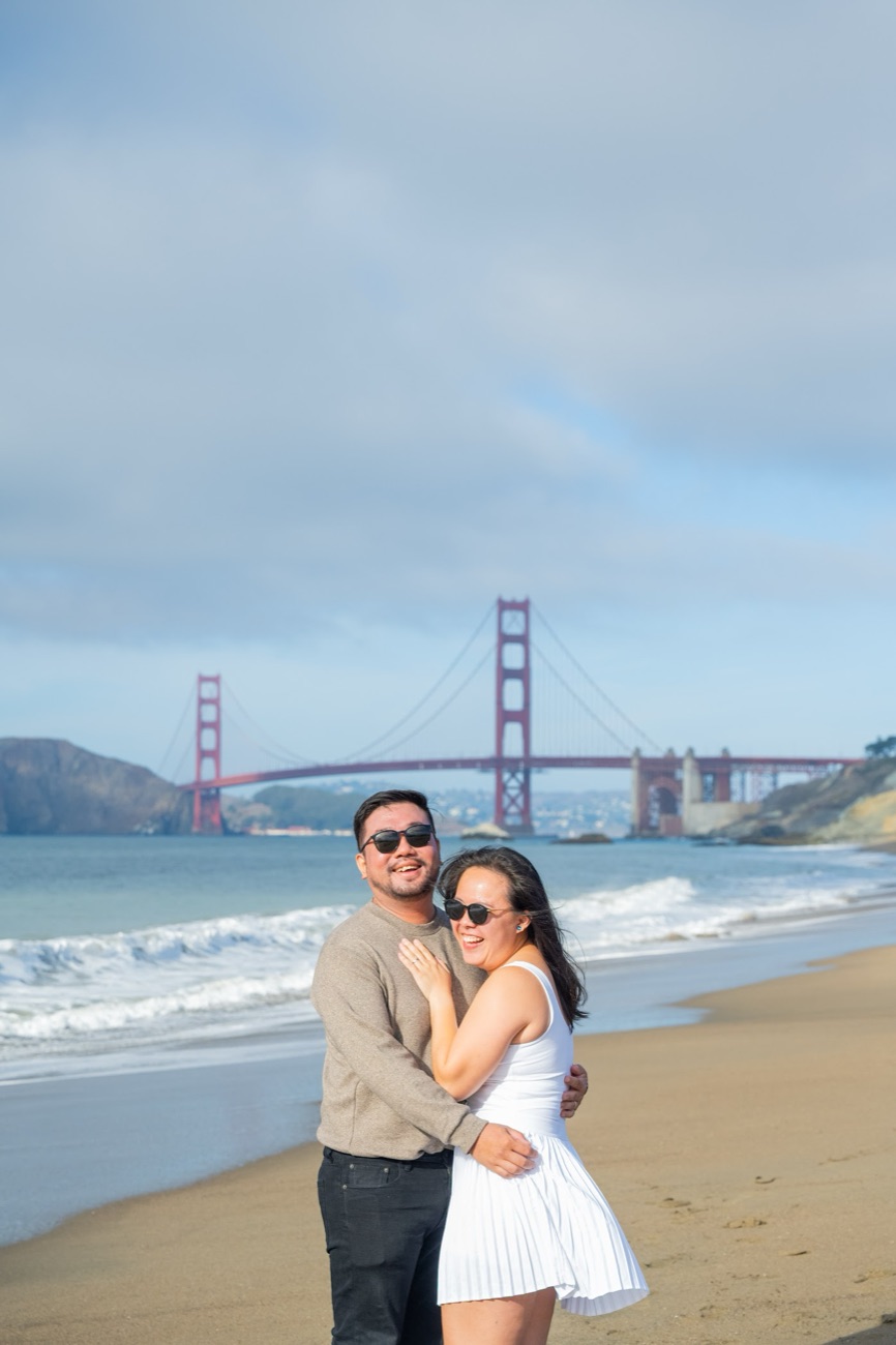 Isaac Tan on Baker Beach with the Golden Gate Bridge behind, San Francisco.